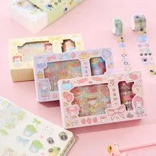 Detailed view of colorful washi tape rolls and decorative stickers in sweet gift box sets