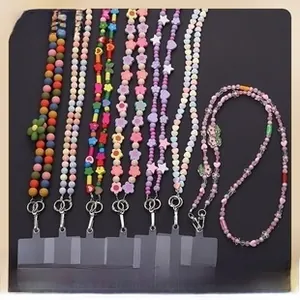 Detail of colorful acrylic beaded phone lanyards with metal hooks and clear patches