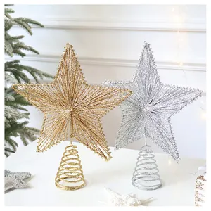 Close-up of champagne gold and silver iron wire star toppers for Christmas trees