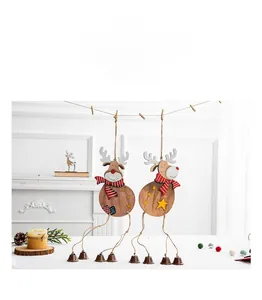 Detailed view of wooden Christmas reindeer ornaments with hanging bells and scarves