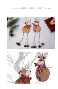 Close-up of wooden Christmas reindeer ornaments with bells and festive scarves