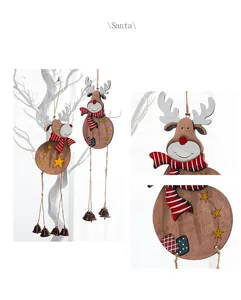 Close-up of wooden reindeer Christmas hanging decor featuring bells and festive motifs