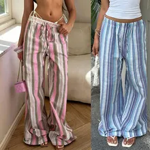Detail of high waisted striped wide leg pants featuring adjustable drawstring waist