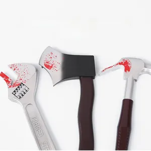 Detailed view of bloody plastic Halloween props including wrench, axe, and hammer tool set