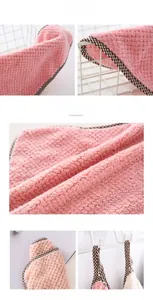 Detail of pink pineapple texture coral fleece towel with hanging loop and absorbent fabric