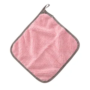 Pink waffle weave coral fleece kitchen towel with hanging loop and checkered edge trim