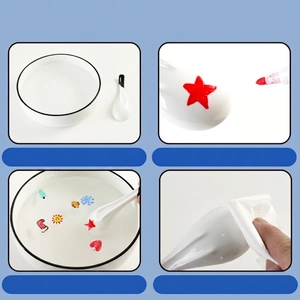 Floating ink markers for kids creating magic water drawings with a ceramic spoon