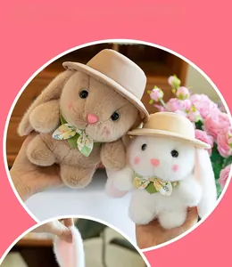 Detail of plush bunny pair with soft faux fur, floral bows and firm filling for kids