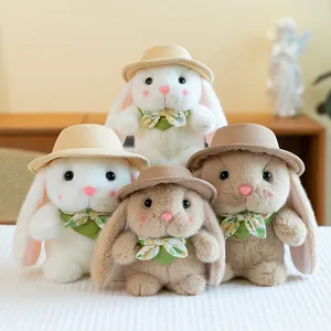 Cute plush bunny dolls with sun hats and floral bows in white and light brown tones