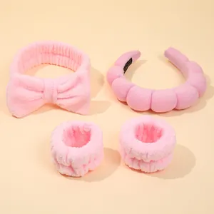 Pink microfiber spa set with bow headband, puffy sponge hair hoop, and soft wrist wash bands