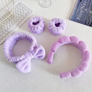 Lavender plush spa set including bow headband, wave hairband, and soft wristbands