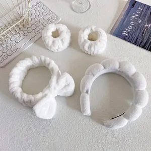 White sponge headband and wristband set for facial cleansing and makeup beauty care