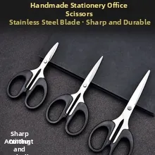 Three-piece stainless steel office scissors set with ergonomic black handles on textured grey background