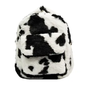 Cute cow print plush backpack with soft faux fur texture and golden metal zippers