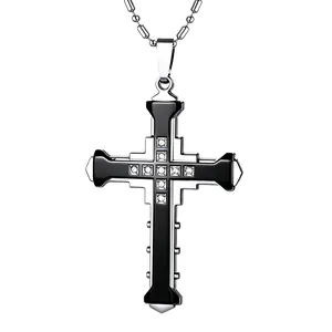 Macro view of silver cross pendant with black enamel inlay and 11 sparkling crystals