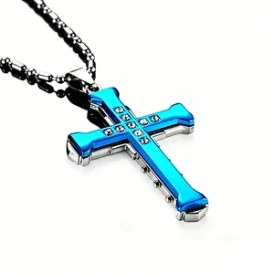 Macro detail of silver cross pendant featuring blue inlay and sparkling cubic zirconia
