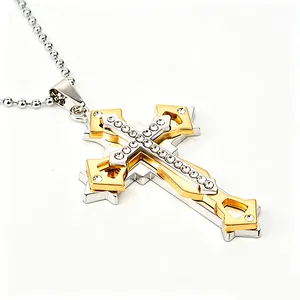 Macro shot of two-tone gold and silver cross pendant with sparkling rhinestones details