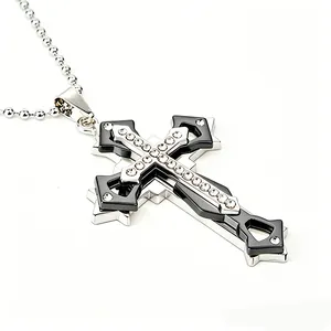 Detailed view of silver and black layered cross pendant with crystal inlay on bead chain