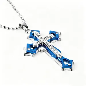 Close-up of triple-layered cross pendant with sparkling crystals and vibrant blue inlay