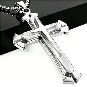 Macro shot of silver layered geometric cross pendant with industrial metallic textures