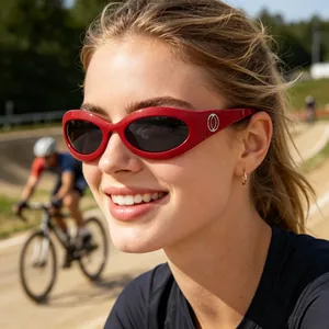 Detail of red cycling sunglasses with silver metal hinges and UV lenses on model