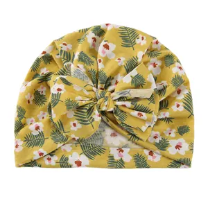 Newborn baby knot headband hat with floral print and large bow in ginger yellow color