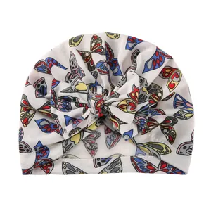 Newborn cotton turban hat with colorful butterfly print and large bowknot detail