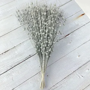 Detail of decorative silver glitter berry stems for Christmas and floral arrangements