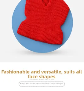 Detail of red knit balaclava showing thick ribbed texture and three-hole face mask design