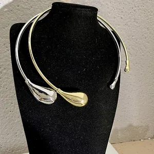 Minimalist metallic teardrop choker necklace in polished gold and silver finishes
