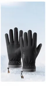Detail of waterproof winter ski gloves showing touchscreen finger tips and windproof cuffs