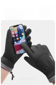Close-up of waterproof ski gloves featuring touchscreen fingertips and fleece-lined wrist