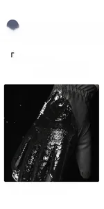 Close-up showing water-repellent fabric performance of thermal cycling gloves