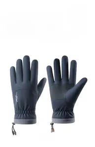 Detail of blue waterproof ski gloves showing non-slip palms and adjustable wrist cords