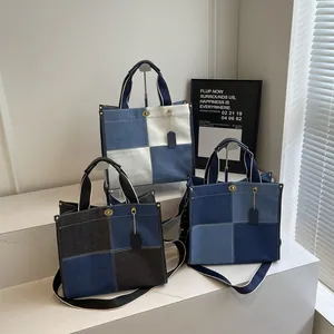 Canvas denim patchwork tote bag with adjustable shoulder strap and metal turn-lock