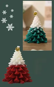 Macro detail of Christmas tree candles with dual-color gradient and golden bell decor