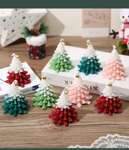 Detail of Christmas tree candles with two-tone gradients and small gold bells on top