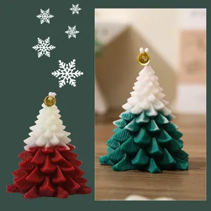 Christmas tree scented candles with gold bells in gradient red and green colors