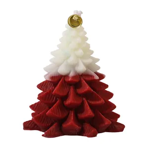 Christmas tree scented candle in red and white dual colors with a small golden bell