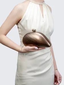 Detailed view of luxury brown marble texture acrylic clutch with gold ball clasp