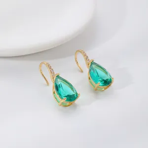 Elegant gold drop earrings with pear-cut emerald zircon and micro-paved white crystals