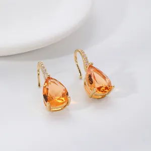 Elegant gold drop earrings with pear-cut orange zircon and micro-pave white crystals