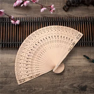 8 inch Chinese sandalwood style folding fan with intricate hollow laser cut carvings