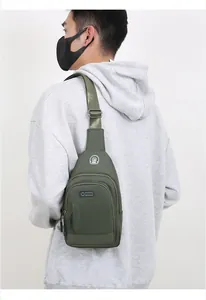 Detail showing the military green waterproof nylon chest bag with a sport earphone jack