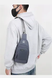 Detailed view of gray-blue sports chest bag with waterproof oxford fabric and logo