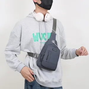 Gray-blue outdoor cross-body chest bag with multiple zip pockets and headphone port