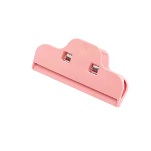 Detailed view of pink wide plastic food clip with strong stainless steel springs