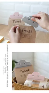 Food sealing clips in pink and gray showing strong spring grip on snack bags