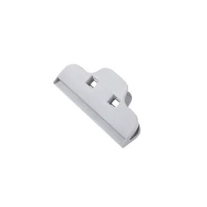 Minimalist grey plastic food sealing clip with ergonomic grip for kitchen bag closure