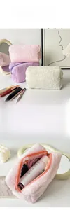 Detailed interior view of plush makeup bag showing large capacity and soft texture